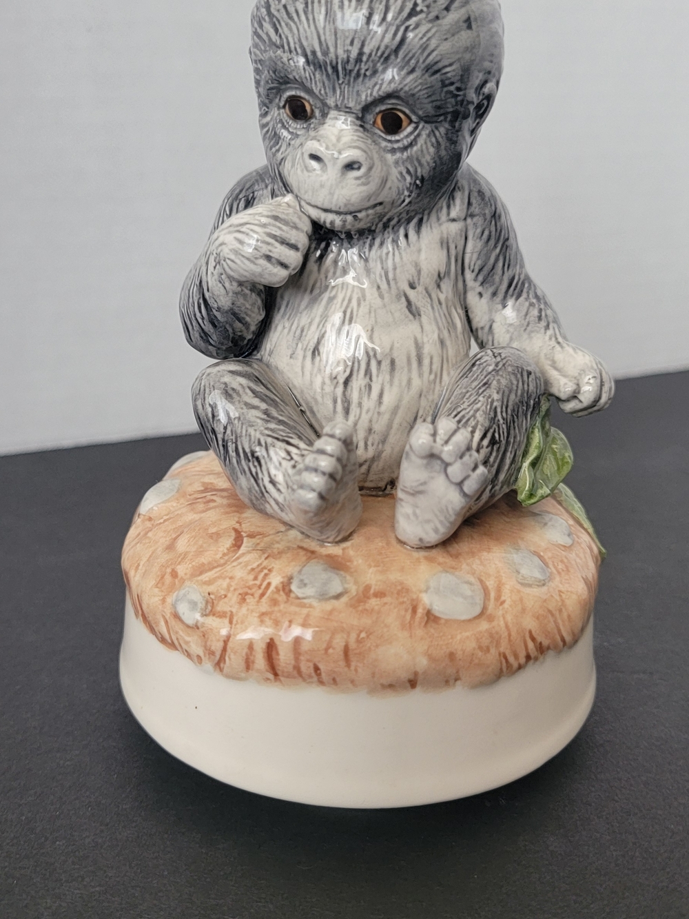 Otagiri Gray Baby Gorilla Figurine on Tan Mushroom